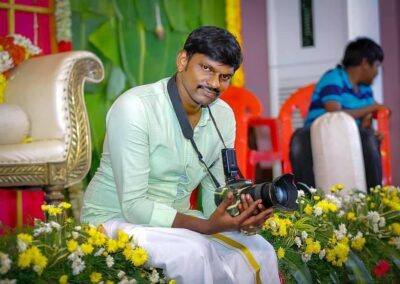 Rajamurugan, professional photographer, capturing a moment with his camera